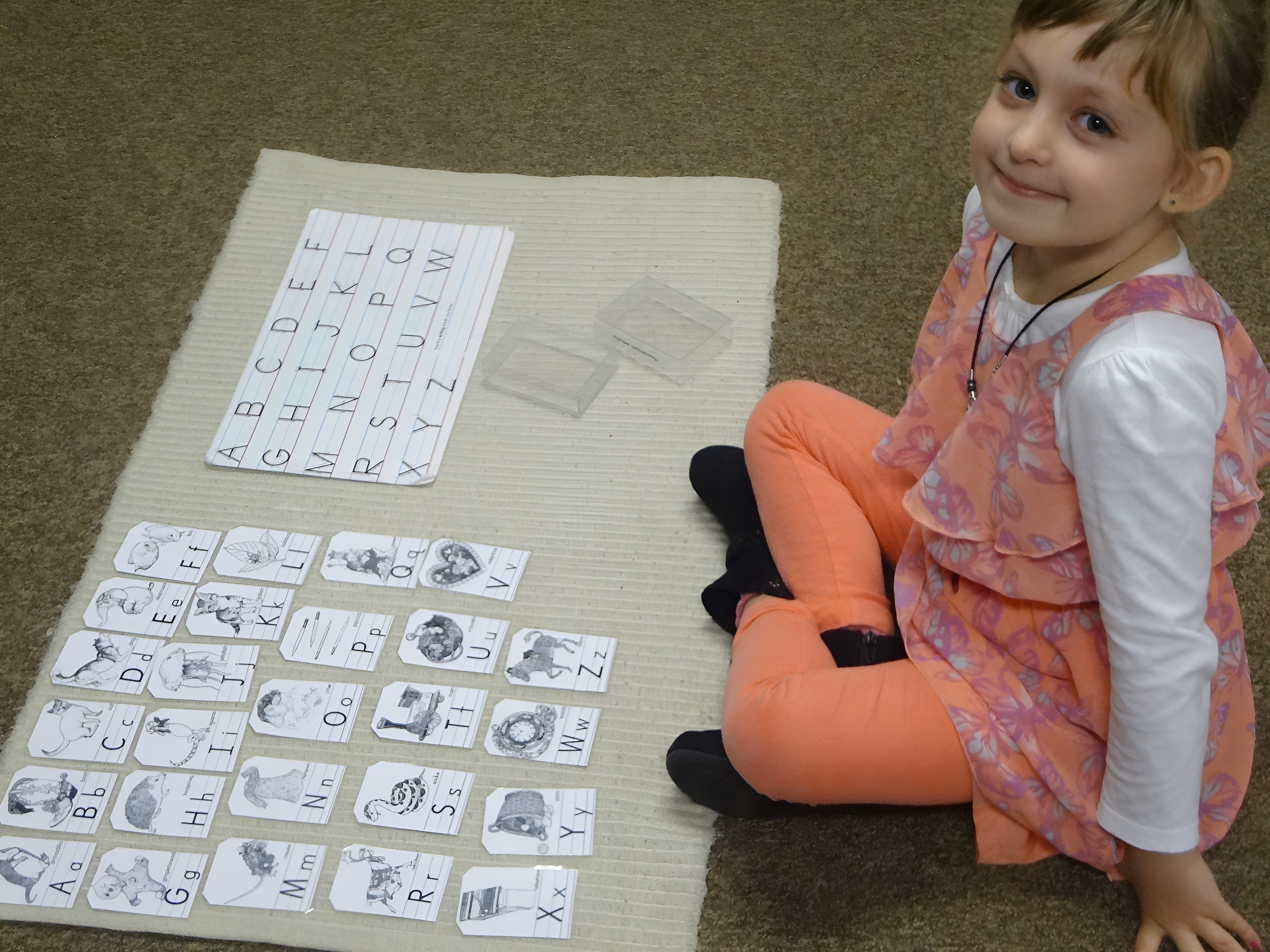An Ann Arbor child building words with the movable alphabet