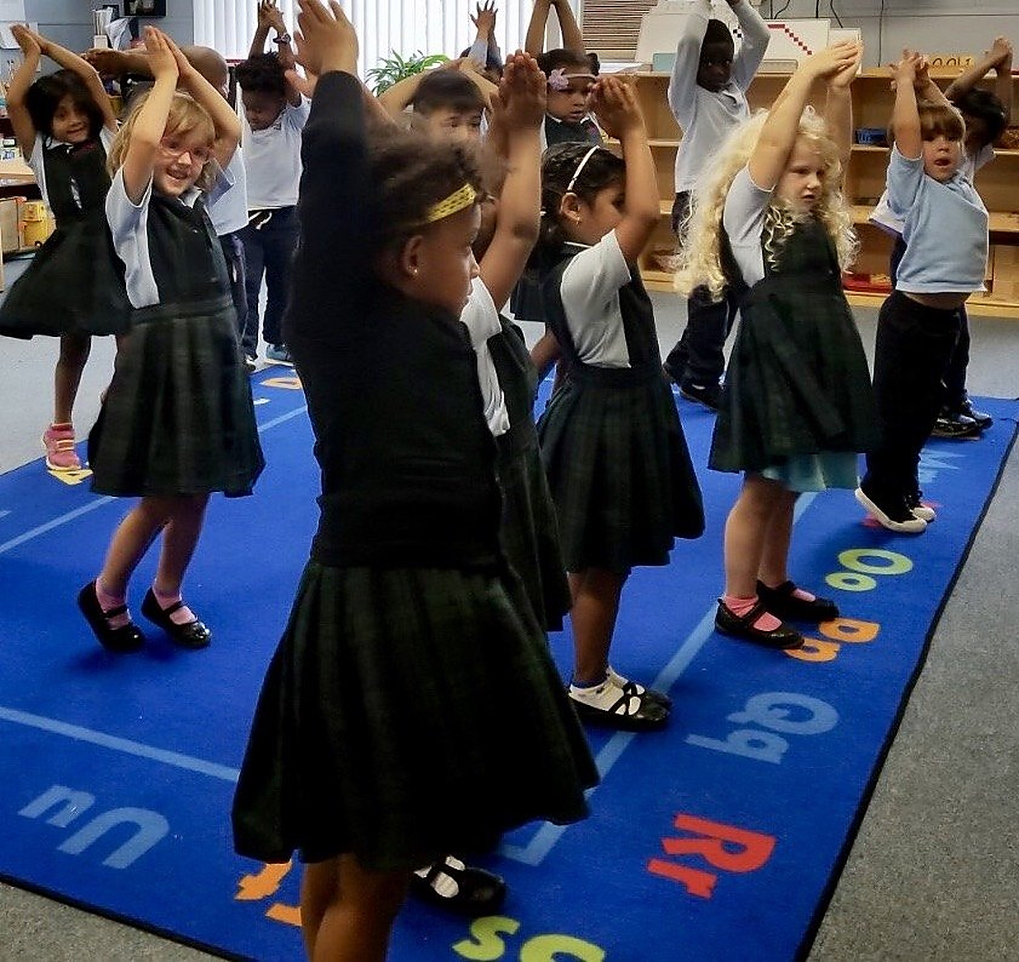 Children practicing simple yoga poses on mats