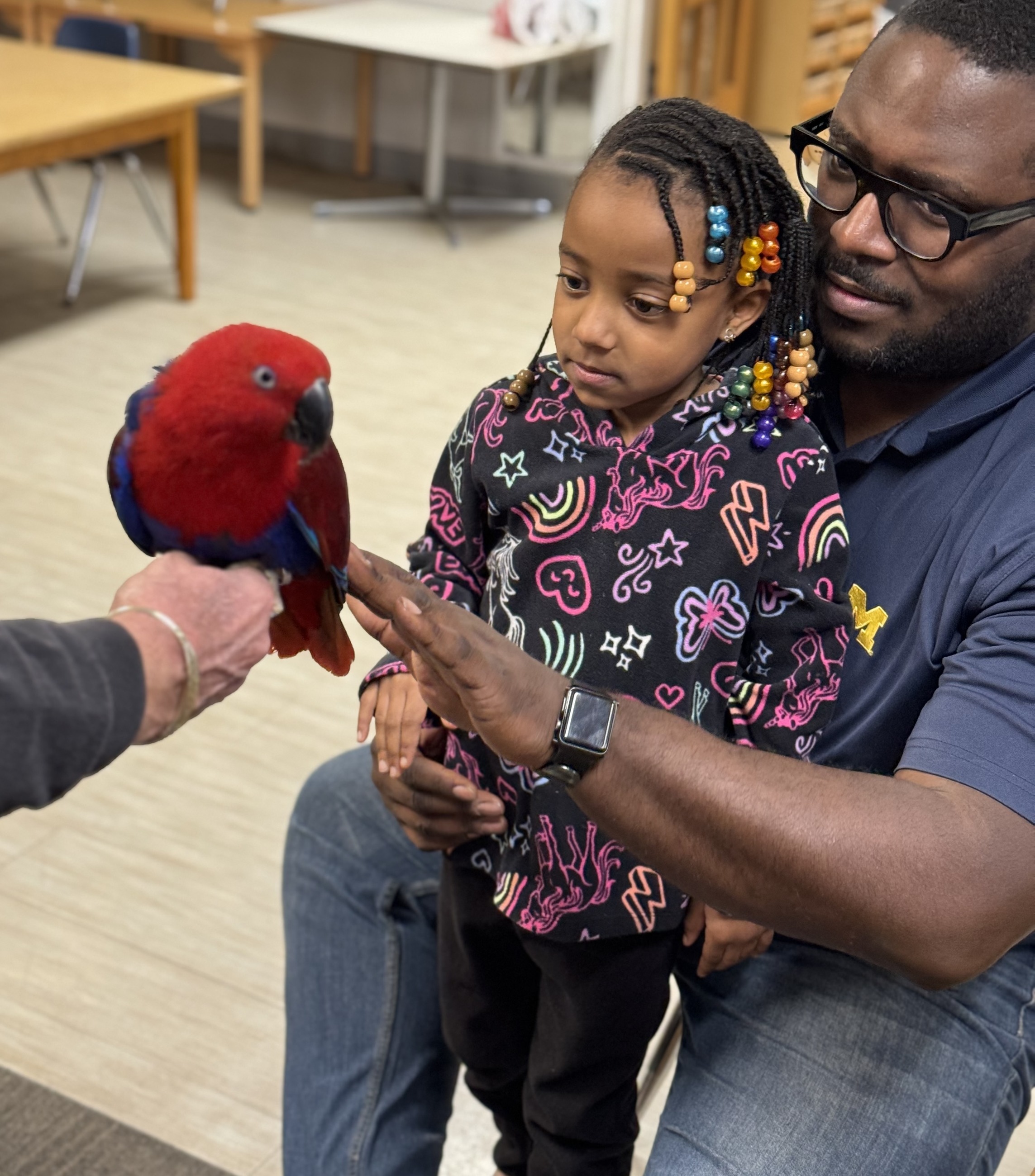 Ann Arbor children meeting a visiting parrot