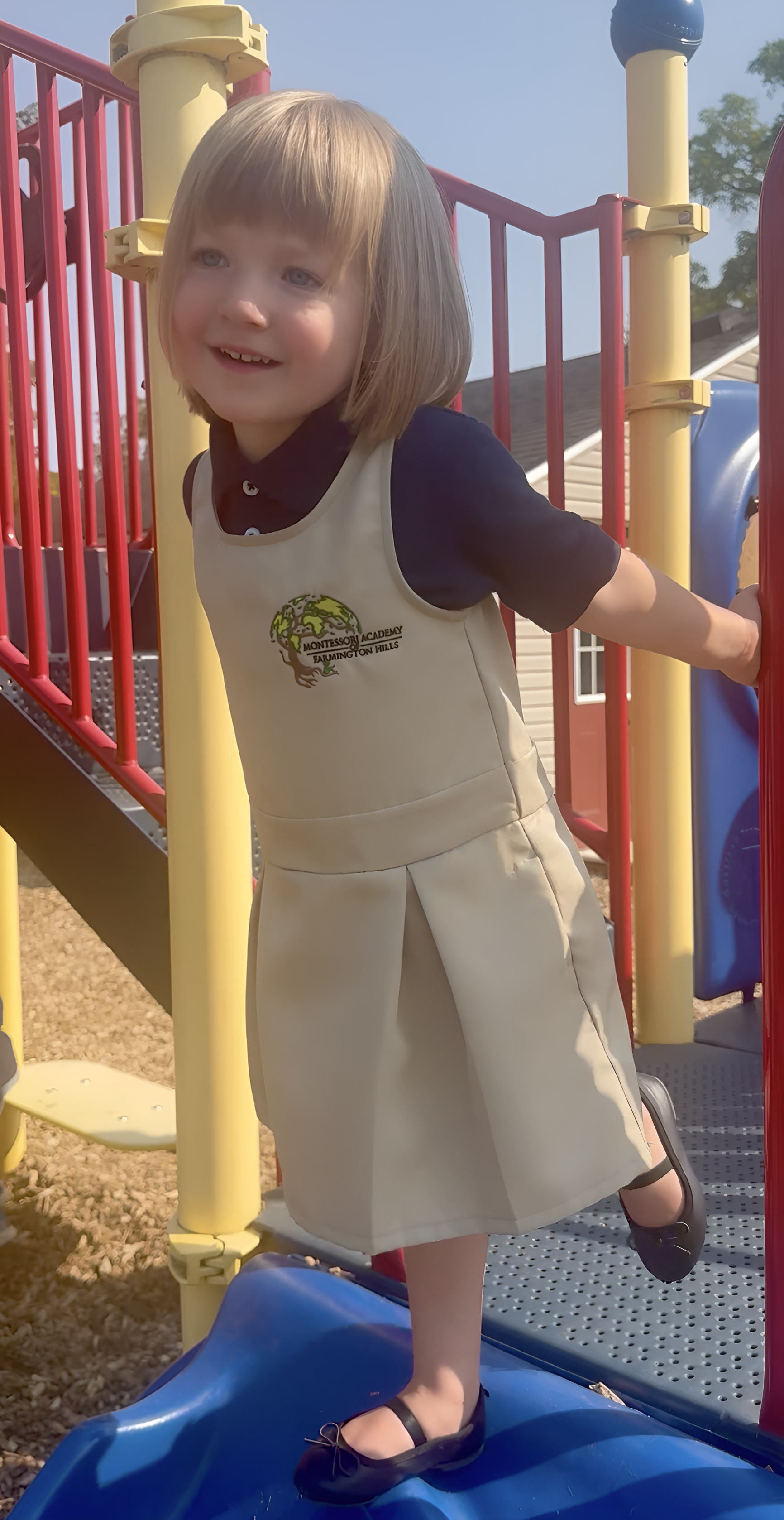 A Farmington Hills child practicing pouring in Practical Life