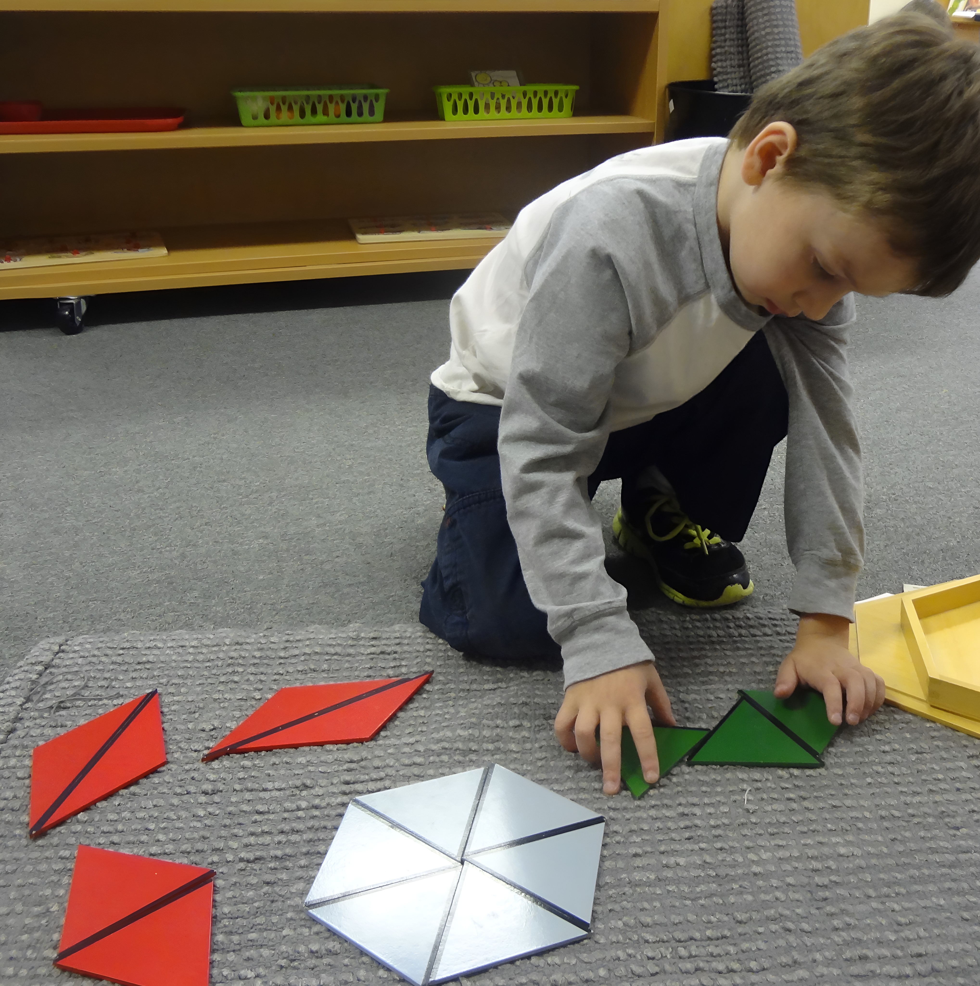 A Canton student working with the hundred board