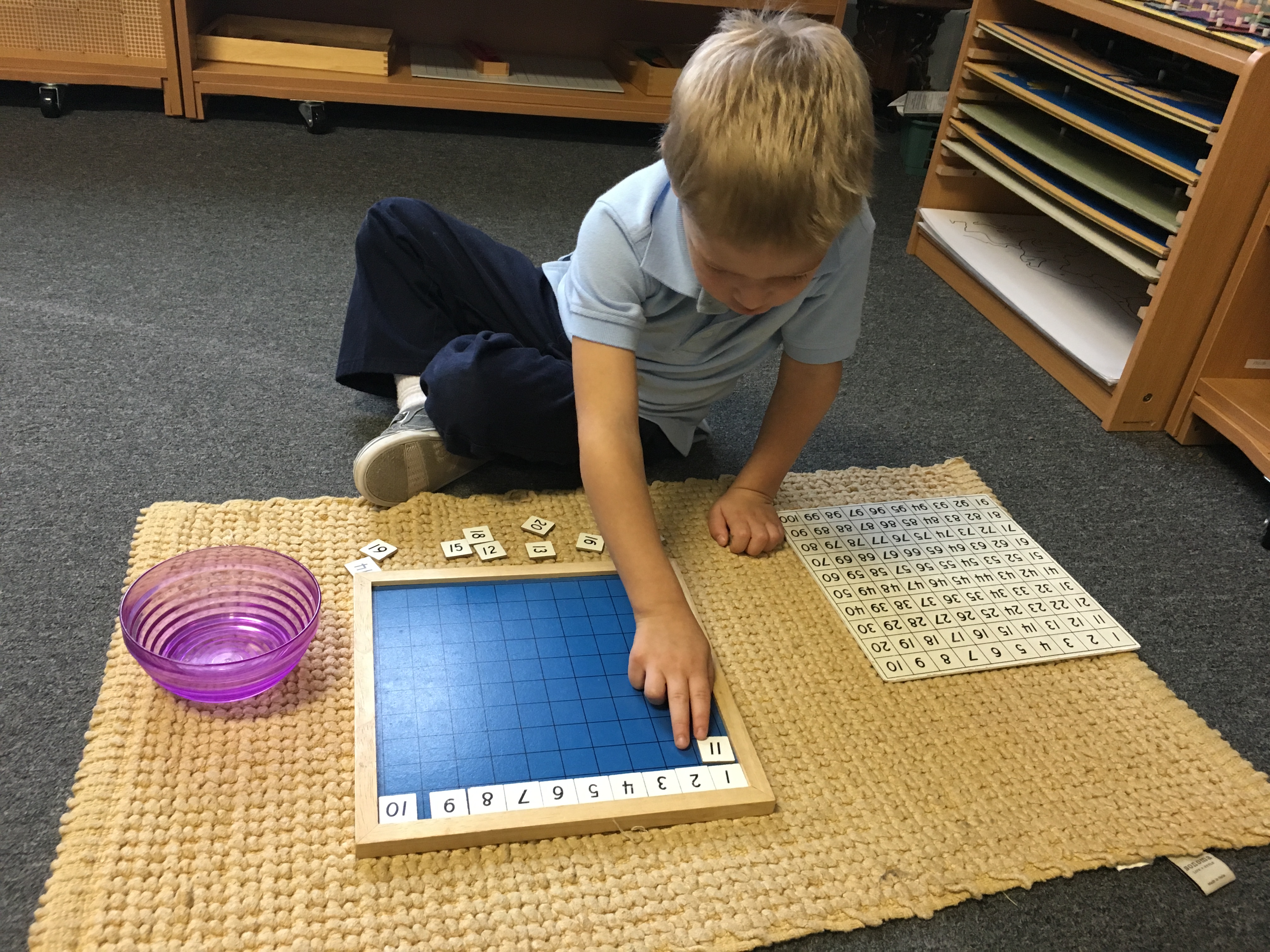 A child working with Montessori number materials